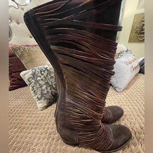 Freebird leather boot with leather fringe around front of boot. Size 10